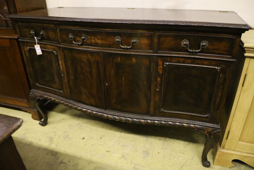 A 1920s Chippendale revival mahogany bowfront sideboard, width 152cm depth 63cm height 100cm
